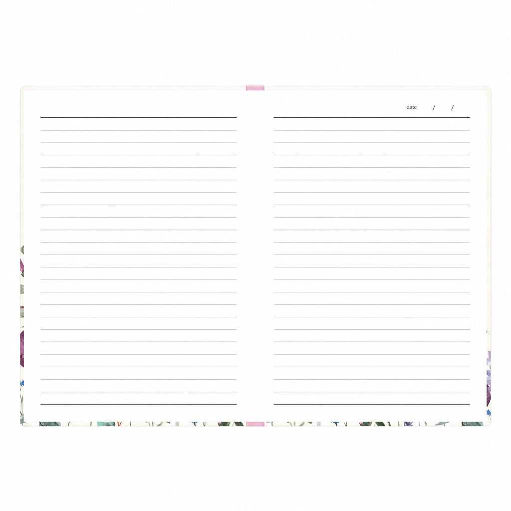 Open Wild Harmony A5 notebook showing lined white pages, a date field on the right-hand page and floral detailing around the edges, on a white background