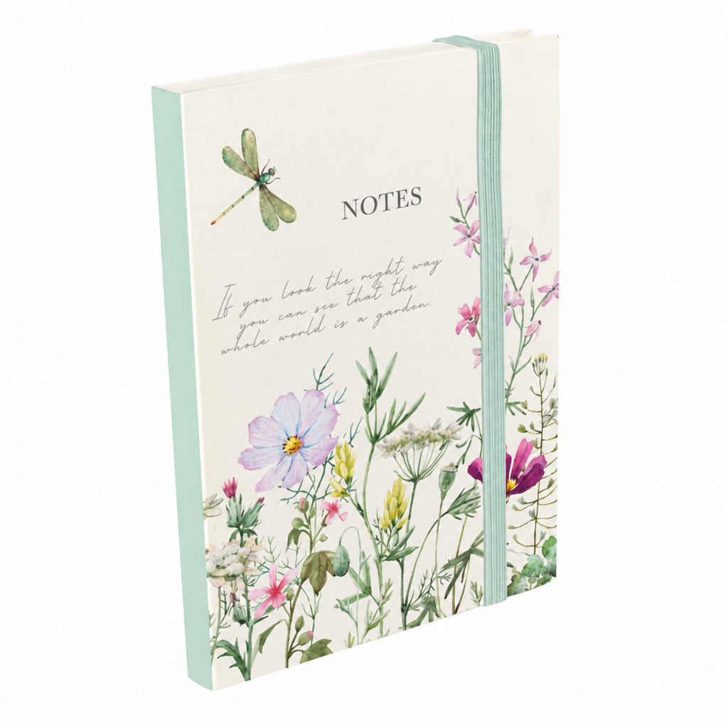Wild Harmony A6 notebook with a cream wildflower and dragonfly cover, ‘Notes’ lettering and a mint-green elastic closure, on a white background.