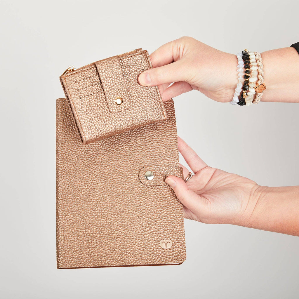 Rose gold Pearl Duo purse being placed into a matching larger pouch.