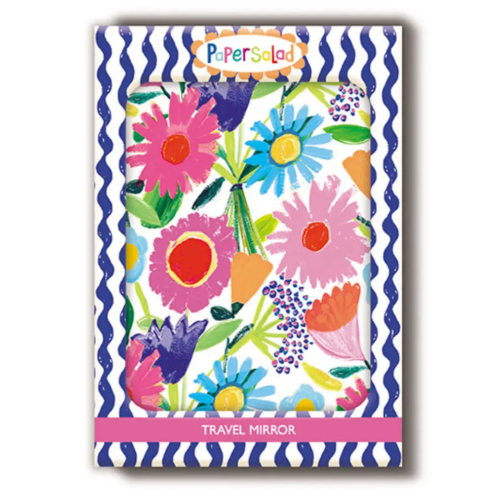 Compact travel mirror with colourful pink, blue, purple and orange flowers, framed by a blue and white wavy border