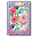 Compact travel mirror with colourful pink, blue, purple and orange flowers, framed by a blue and white wavy border