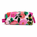 A rectangular zippered pouch with a textured pebbled finish, featuring a vibrant floral print in pink, orange, green, and white. A pink tag on the left reads 'Piper Sandler' and a matching pink zipper pull is visible on the right.