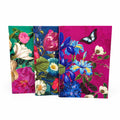 Set of three Botanist Collection A6 notebooks with green, blue and magenta floral covers, including a butterfly design, displayed on a white background.