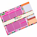 Weekly planner pad on a light grey background, featuring pink, orange and white sections with colourful patterned borders and a central white paper band.
