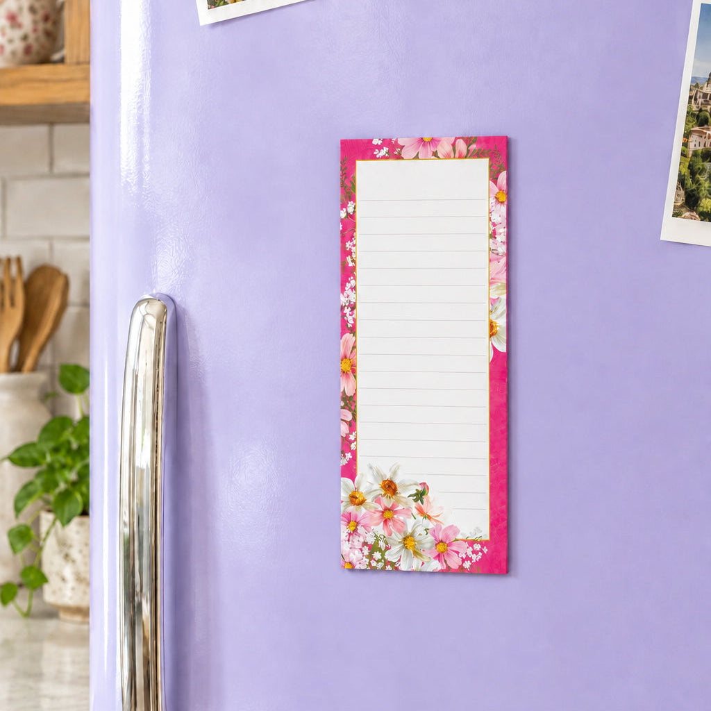 A lined notepad page with a pink floral border and white flowers along the bottom edge.