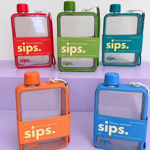 Five flat, clear water bottles with red, green, teal, orange and blue caps and edging, displayed on lilac stepped platforms