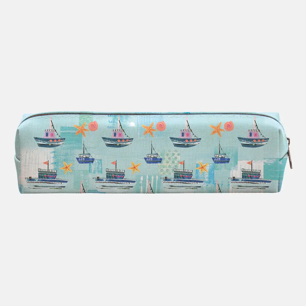 A rectangular zippered pencil case featuring a colorful nautical pattern of sailboats, starfish, and suns on a light blue background, shown against a plain light gray studio backdrop.