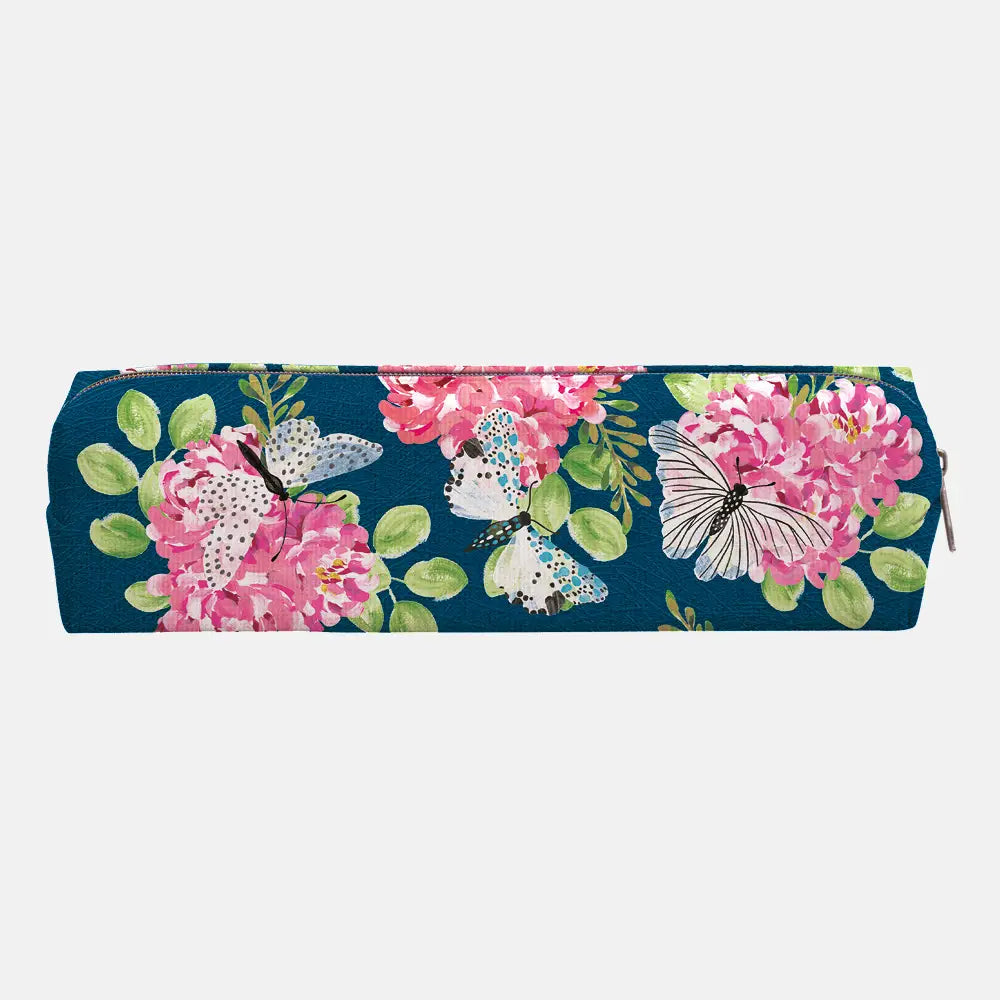 A long rectangular zip pouch with a navy blue background and a vibrant floral and butterfly print featuring pink flowers and green leaves, shown against a light gray background.