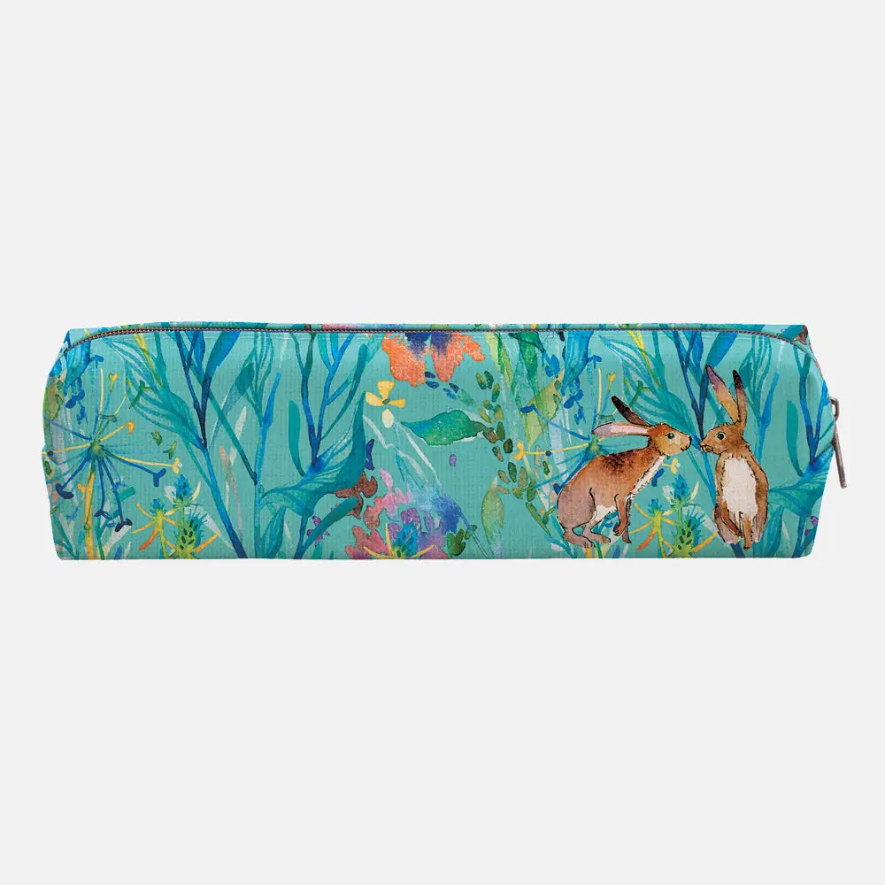 A rectangular zippered pencil case featuring a colorful watercolor-style print of two hares among blue-green leaves and wildflowers, shown on a plain light gray background.